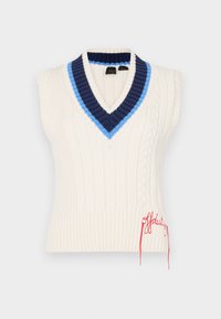 Cream sleeveless sweater with a V-neck, featuring blue and navy ribbed accents, cable knit detail, and red embroidered text at the hem.