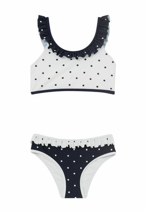 Tweedelig bikini met witte en marineblauwe polkadots, met gerafelde rand bij de bovenkant halslijn en de tailleband van de onderkant.