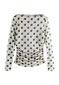 Langærmet top i transparent stof med sorte prikker på en lys baggrund, der har et sammensnøret design ved taljen.