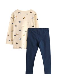 Completo per toddler con maglia a maniche lunghe di colore crema con motivi di veicoli colorati e leggings navy in morbido cotone.