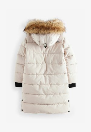 Vooderdatud koorikrept kreemivärvi parka, millel on karvane kapuuts, ribikojad ja pikk siluett. Omab horisontaalset õmblust ja brändimist seljal.