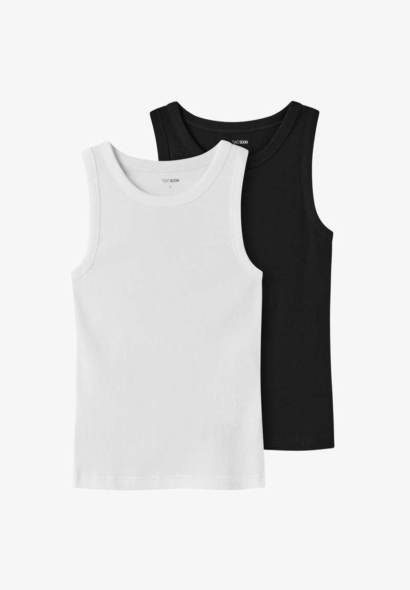 Twee stuks mouwloze tanktops in wit en zwart. Geribbelde structuur, ronde halslijnen en gestikte zoom. Zacht katoenen materiaal.