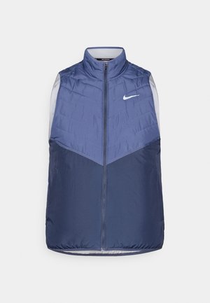 Gepolsterte ärmellose Weste in Marineblau, mit hohem Kragen, Reißverschluss und strukturiertem Oberteil mit weißem Nike-Logo.