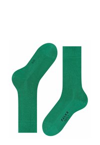 Zielone bawełniane skarpetki z gładką teksturą, prążkowanym ściągaczem i nadrukowanym logo na podeszwie. Zaprojektowane z myślą o komforcie i dopasowaniu.