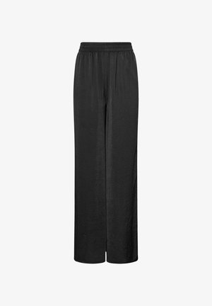 Pantalons larges noirs en tissu léger avec une taille élastique, présentant une texture lisse et sans ornements visibles.