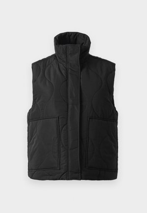 Black quilted sleeveless vest with high collar, front pockets, and concealed front zipper on a white background.