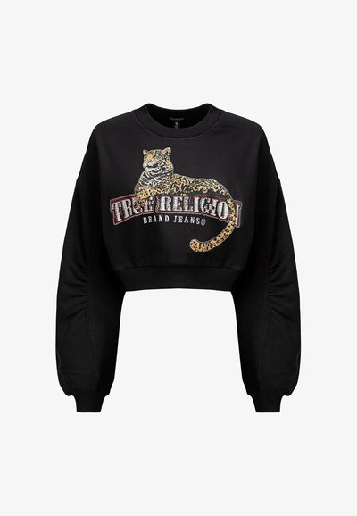 Sweatshirt noir court avec un graphisme léopard et le texte "True Religion Brand Jeans" en rouge et blanc. Tissu doux avec des poignets élastiques.