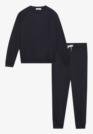 Sweatshirt bleu marine foncé avec des manches raglan et un ourlet côtelé, associé à un pantalon de jogging assorti avec une taille élastique et un cordon de serrage.