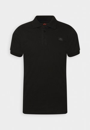 Schwarzes Polohemd aus Baumwolle. Verfügt über einen Kragen, eine Knopfleiste mit drei Knöpfen, kurze Ärmel und ein kleines, markiertes Patch auf der Brust.