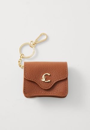 Brown leather card holder with a textured finish, gold hardware clasp, and a curved flap. Includes a chain with a circular keyring.