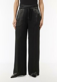 Black leather wide-leg pants with a drawstring waist, featuring a smooth texture and clean lines for a modern look.