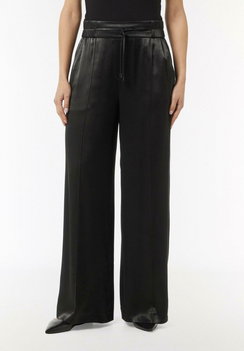 Black leather wide-leg pants with a drawstring waist, featuring a smooth texture and clean lines for a modern look.
