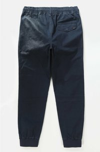 Donkerblauwe joggingbroek van een katoenmix met een elastische tailleband en boordjes aan de enkels. Bevat één achterzak.