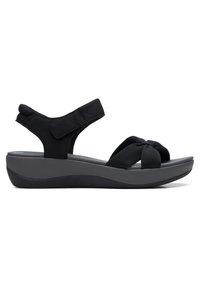 Schwarze Keilsandalen mit einem geknoteten Textilvorderriemen und verstellbarem Klettverschluss am Knöchel. Strukturierte Innensohle mit einer gepolsterten, konturierten Sohle.