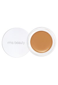 RMS Beauty-crème in een witte ronde container, met een gladde, warme crème met een glanzende afwerking. De deksel heeft een reliëflabel van het merk.