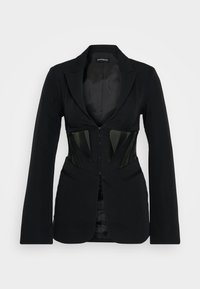 Maßgeschneiderter schwarzer Blazer mit Reverskragen, der ein kontrastierendes schwarzes Korsett-Panel und lange Ärmel aufweist. Glatte Stofftextur.