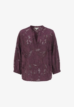 Transparente lila Spitze Bluse mit V-Ausschnitt, dreiviertel Ärmeln und elastischen Manschetten, die mit aufwendigen floralen Mustern versehen ist.