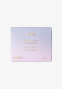 Huxley Skin Glow Cream doos, verloop van paars naar roze, gouden opdruk, bevat ingrediënten: cactusbloemextract, 50 mL, 1,69 fl. oz.