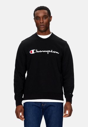 Felpa nera a girocollo realizzata in cotone, con un grande logo "Champion" ricamato in bianco e rosso sul petto.