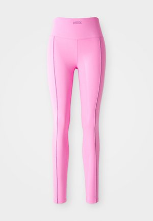 Strakke roze leggings van rekbaar materiaal, met een hoge tailleband en contrasterende zijnaadstiksels. Gladde textuur en geen zichtbare patronen.