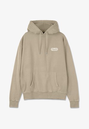 Bēšas kapuces sporta krekls, kas izgatavots no mīksta auduma. Tam ir priekšējā kabata, ribotas piedurknes un neliels logo uz krūtīm.