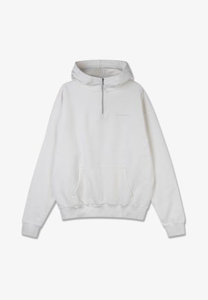 Valge kapuutsiga pusa, mis on valmistatud pehmest puuvillast, sisaldab poole tõmblukuga kaelust, kenguru taskut, ribakudumist varrukatel ja allservas ning diskreetset brändimist rinnal.