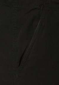 Urban Classics CAMOUFLAGE CARGO PANTS - Cargo trousers - black