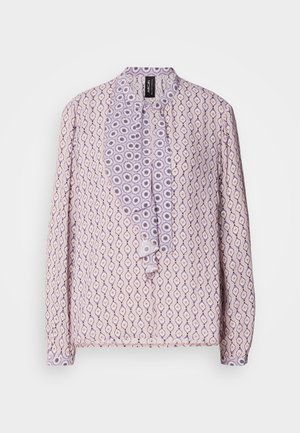 Light purple blouse with an all-over pattern of diamonds and circles, featuring a ruffled front placket and button closures. Long sleeves.