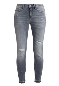 Slim fit jeans i en ljus till medelgrå tvätt, med slitna knäöppningar och fransade avslut. Klassisk femfickorsdesign.