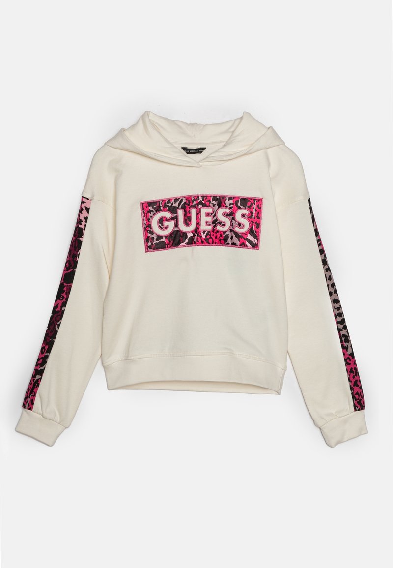 Hoodie crème avec un panneau en imprimé léopard rose et le logo "GUESS" centré. Manches longues avec un imprimé assorti sur les côtés. Tissu texturé.
