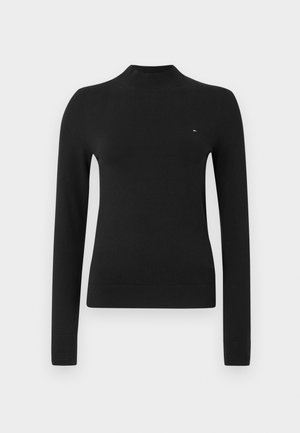 Sweater preto de manga comprida, com gola alta, em um tecido de malha suave. Apresenta uma silhueta ajustada e um pequeno detalhe de logo no peito.