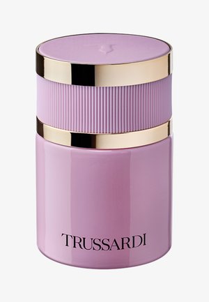 Lavender cylindrical perfume bottle with ribbed gold-accented cap and "TRUSSARDI" brand name on the front.