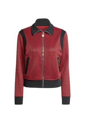Rote und schwarze Reißverschlussjacke mit Hahnentrittmuster, geripptem Kragen und Bündchen sowie seitlichen Taschen. Aus strukturiertem Stoff mit schwarzen Akzenten gefertigt.