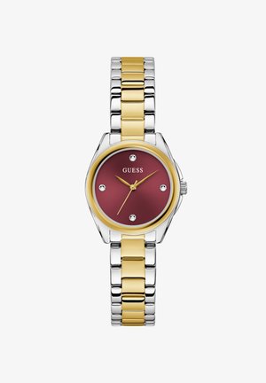 Guess sat sa satenskim čeličnim remenom u srebrnoj i zlatnoj boji, s burgundijskim brojčanikom, koji sadrži šest dijamantnih akcenata i okruglu kućište.