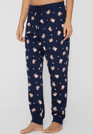 Pantalon de pyjama bleu marine avec taille ajustable à cordon, orné d'un motif ludique d'ours et de cœurs. Confectionné en tissu doux avec poignets côtelés, offrant une coupe confortable.