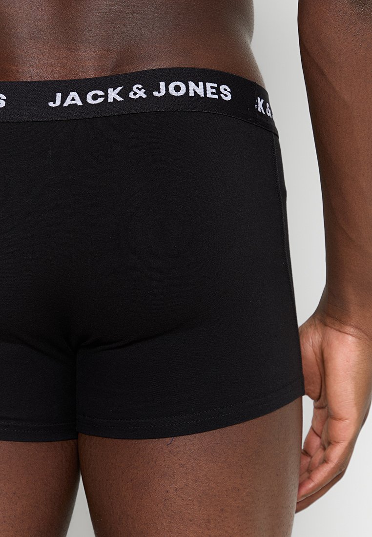 Schwarze Boxershorts aus weichem Stoff, mit einem weißen Jack & Jones Logo am elastischen Taillenbund. Enganliegendes Design mit glatter Textur.