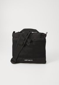 Musta reppu, joka on valmistettu kankaasta ja jossa on verkkokankaiset yksityiskohdat. Varustettu ylhäältä löytyvällä kahvalla ja säädettävällä olkahihnalla. Vetoketjukiinnitys ylhäällä.