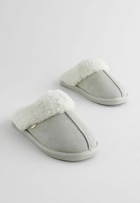 Gray suede slippers with a fluffy white faux fur band at the top; slip-on design; flat sole; simple stitching detail.