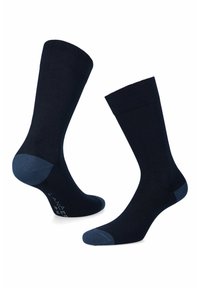 Granatowe skarpetki o żeberkowej teksturze z jasnoniebieskimi akcentami na pięcie i palcach. Klasyczny krój do długości łydki.