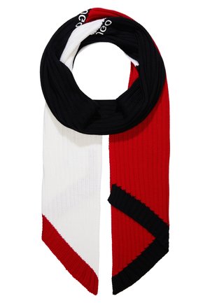 Sciarpa a maglia con costine verticali in blocchi di colore nero, bianco e rosso, piegata a forma di anello con estremità appuntite.