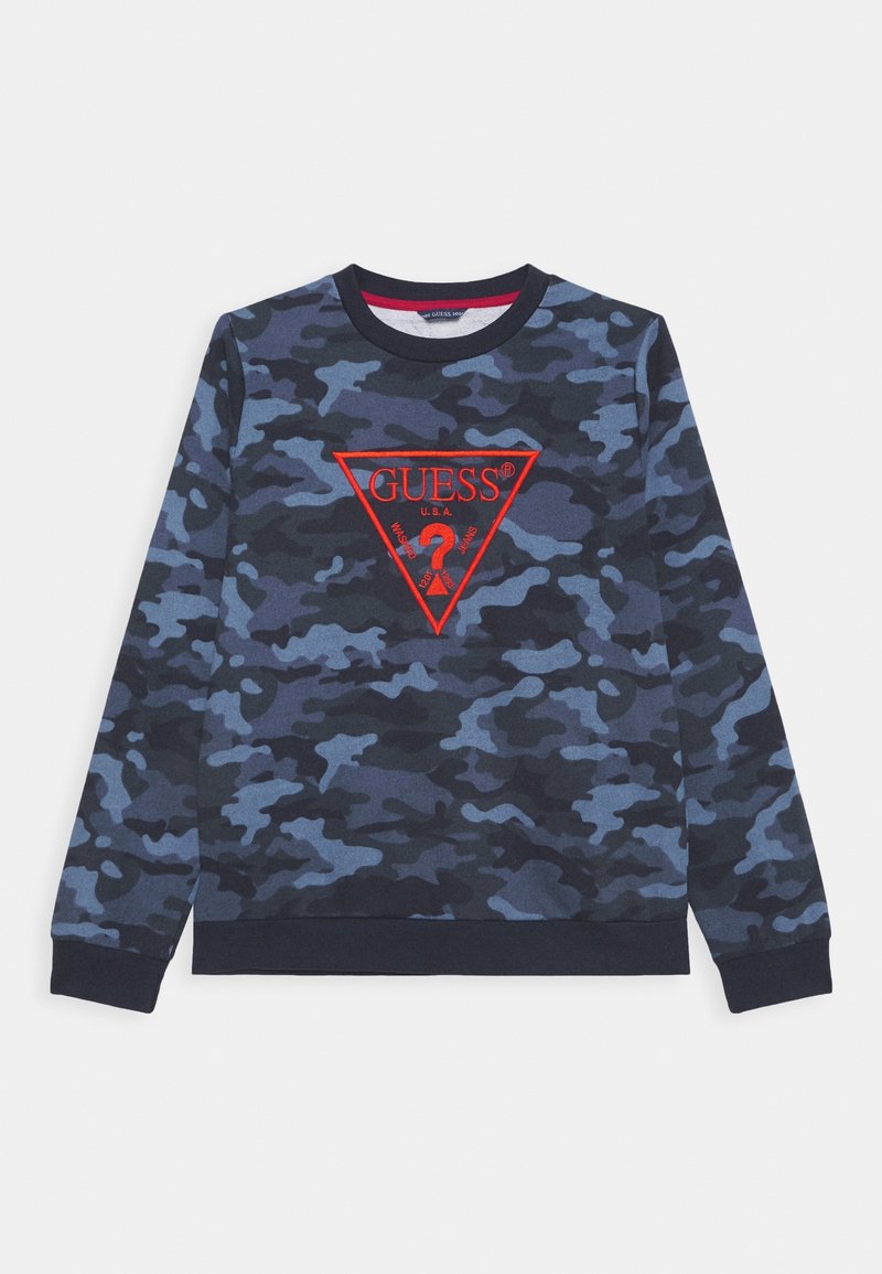 Sweat-shirt camouflage avec un logo triangulaire rouge, fabriqué en tissu doux avec des poignets et un ourlet côtelés, dans des nuances de bleu marine et bleu clair.