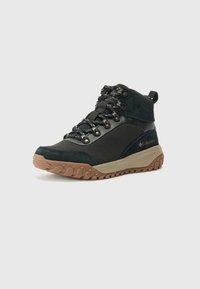 Black mid-cut hiking boots with textured surface, sturdy laces, and a grip outsole, angled left against a white background.