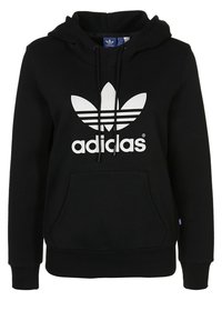 Mustapaita, joka on valmistettu puuvillasta, jossa on kenguruhyppy, ja jossa on suuri valkoinen Adidas-trefooli-logo edessä sekä nyöritettävä huppu.