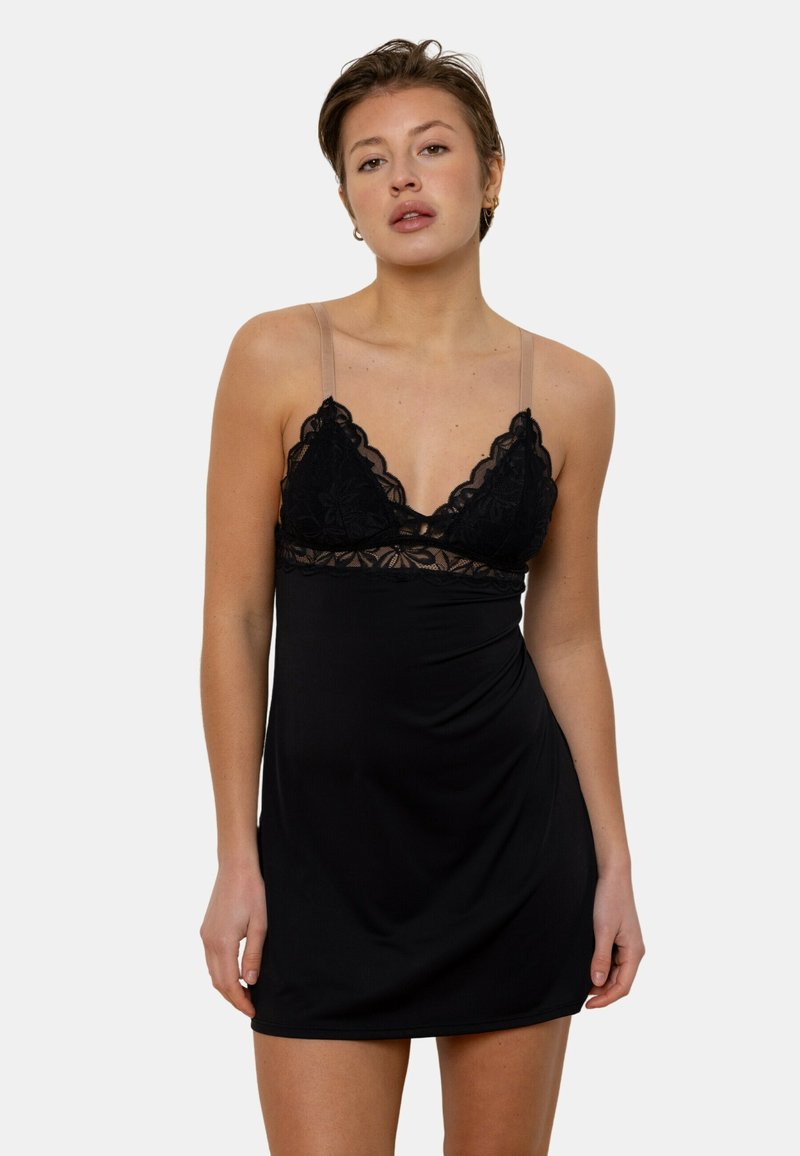 Robe noire avec des détails en dentelle au buste et des épaules transparentes ajustables. Tissu doux et extensible avec une coupe décontractée.