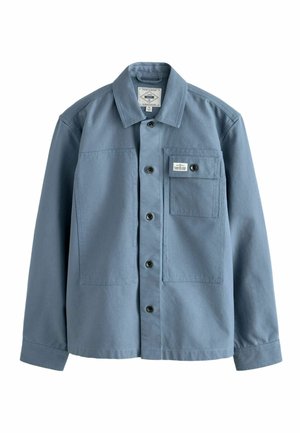 Blue long-sleeve button-up shirt with collar and chest pocket featuring a button and sewn label on white background.