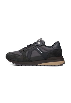 Black athletic sneakers featuring a mix of mesh and suede material, with a rubber sole and contrasting brown accents on the bottom.