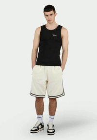 Pegador BARKAN - Tracksuit bottoms - off-white