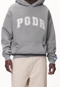 Pegador Jersey con capucha - grey