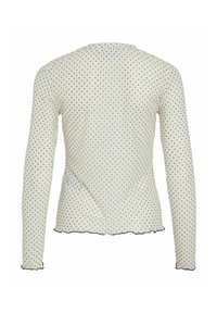 Kremowa bluzka z długim rękawem w czarne groszki, wykonana z miękkiej tkaniny, dopasowanego kroju i falistego dołu. Posiada zaokrąglony tylny dekolt.