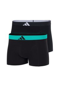 Deux paires de boxers noirs, l'une avec une ceinture turquoise et un logo noir, l'autre avec une ceinture noire et un logo blanc.